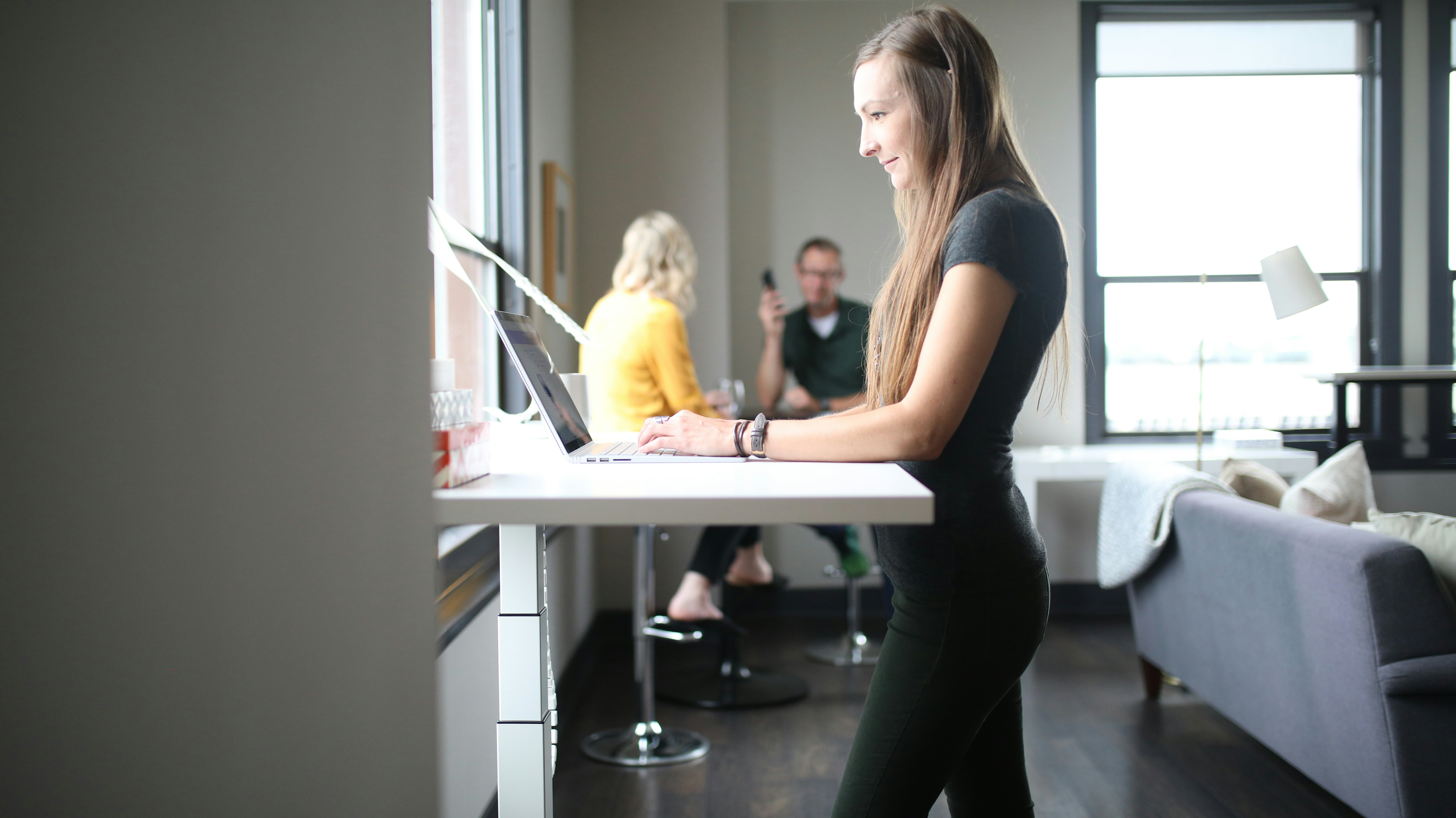 women standing at a desk